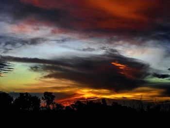 Low angle view of dramatic sky during sunset