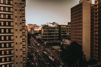 Panoramic view of city street and buildings against sky