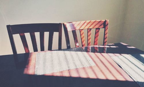Close-up of empty chair on table