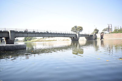 Bridge over river against sky