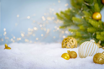 Close-up of christmas decorations on snow