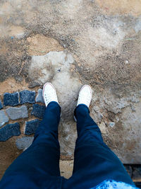 Low section of man standing on floor