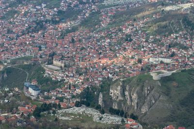 High angle view of townscape and mountains