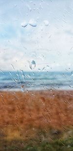 Full frame shot of wet glass window