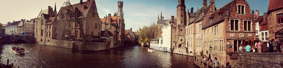 architecture, building exterior, built structure, canal, water, waterfront, residential structure, sky, residential building, house, river, reflection, building, city, outdoors, town, old town, transportation, day, no people