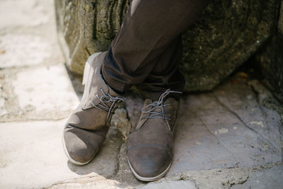 Low section of person wearing shoes