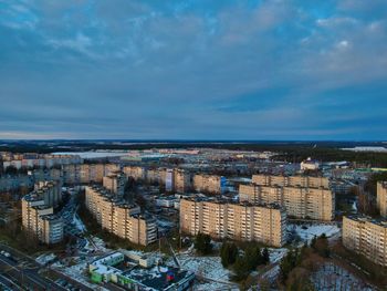 High angle view of buildings in city against sky