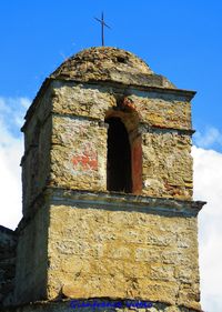 Low angle view of old building against sky