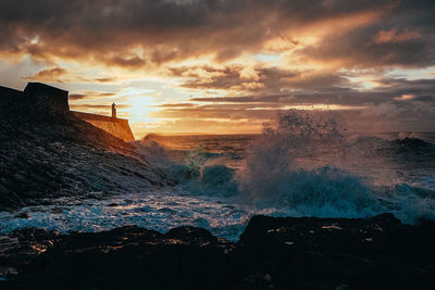 Scenic view of sea against sky during sunset