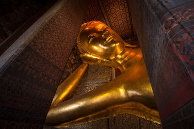 Low angle view of buddha statue