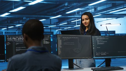 Side view of man working in office