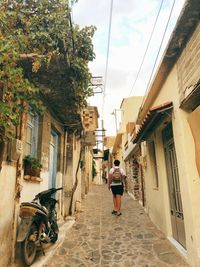 Rear view of people walking on street