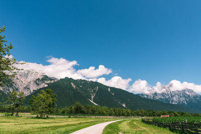 Scenic view of mountain landscape against sky with clouds