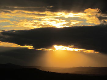 Low angle view of dramatic sky during sunset