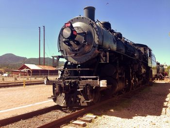 Railroad track against blue sky