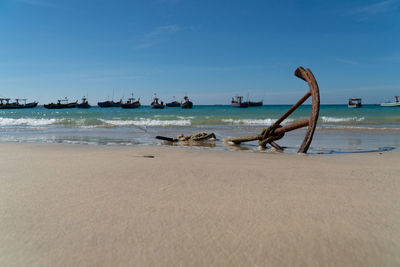 Low angle view of metal anchor on beach in myanmar