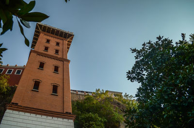 Low angle view of built structure against clear blue sky