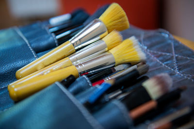 Close-up of make-up brushes in pouch