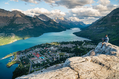 Hiker watching the sunset over waterton national park in alberta