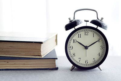 Close-up of clock on table