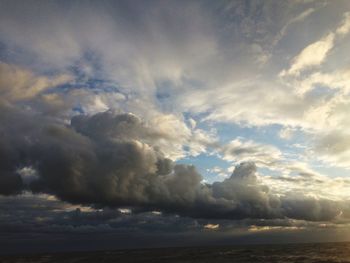 Low angle view of cloudy sky during sunset