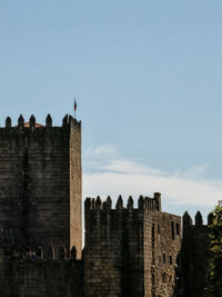 Low angle view of old ruins against clear sky