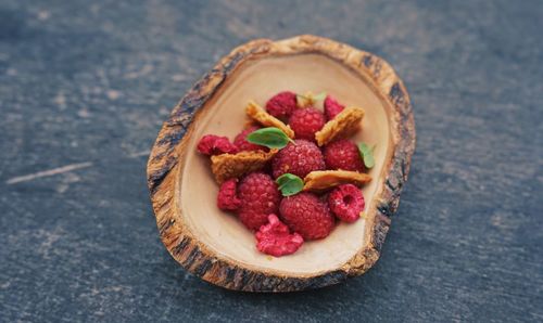 High angle view of strawberries in plate on table