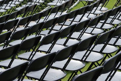 Full frame shot of empty chairs arranged on field