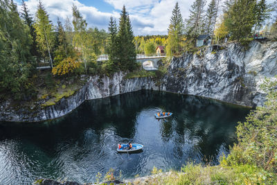 Pleasure boat in marble canyon in the mountain park of ruskeala, karelia, russia