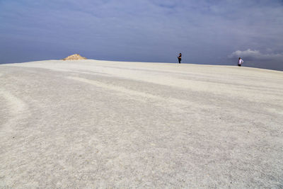 People standing on desert