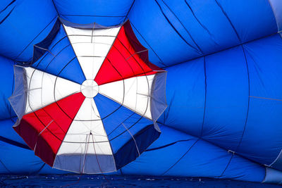 Close-up of hot air balloon against blue sky