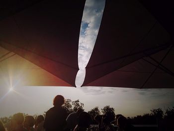 Low angle view of woman against sky