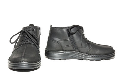 Close-up of shoes against white background