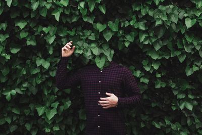 Man standing against trees