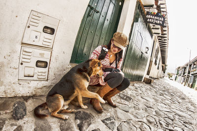 Tourist and stray dog on street