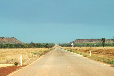 Road amidst landscape against clear sky