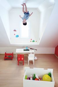 Boy playing with toys at home