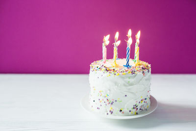 Close-up of birthday cake on table