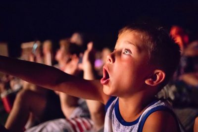 Portrait of young man looking at music concert