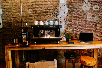 Old fashioned and table on wall at home