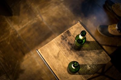 Close-up high angle view of bottles on table