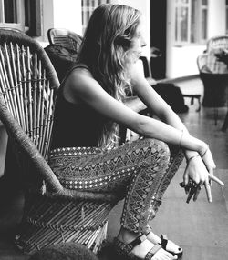 Young woman sitting on chair