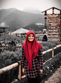 Portrait of man standing in snow