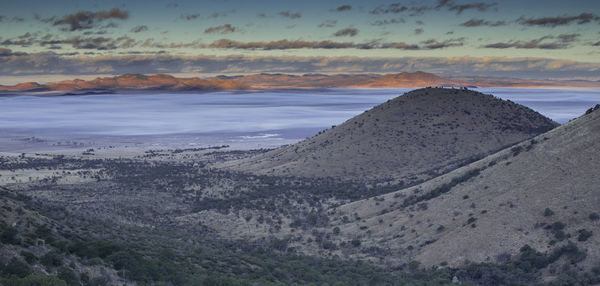 Scenic view of landscape against sky during sunset