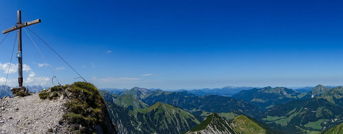 Scenic view of mountains against clear blue sky