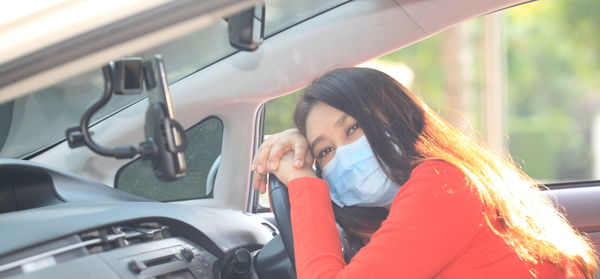 Woman sitting in car