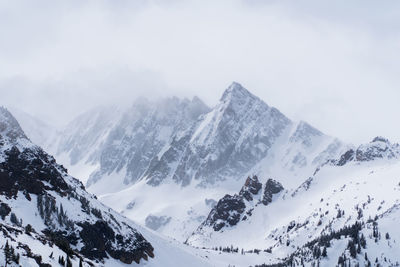 Scenic view of snow covered mountains against sky