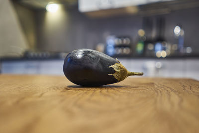 Close-up of eggplant on table at home