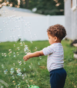 Boy blowing bubbles