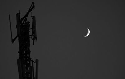 Low angle view of moon against clear sky at night